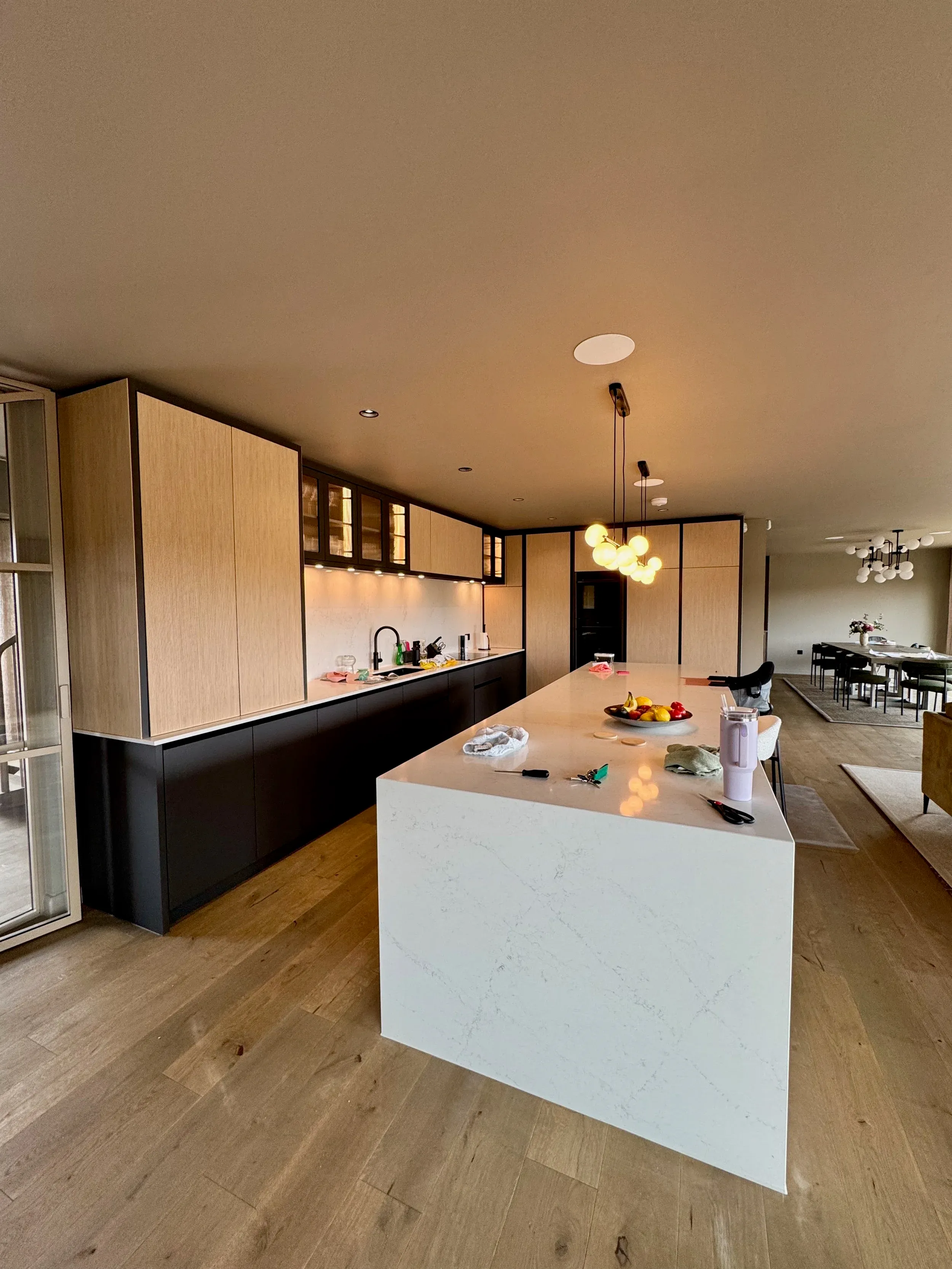 A bespoke kitchen with a marble waterfall island