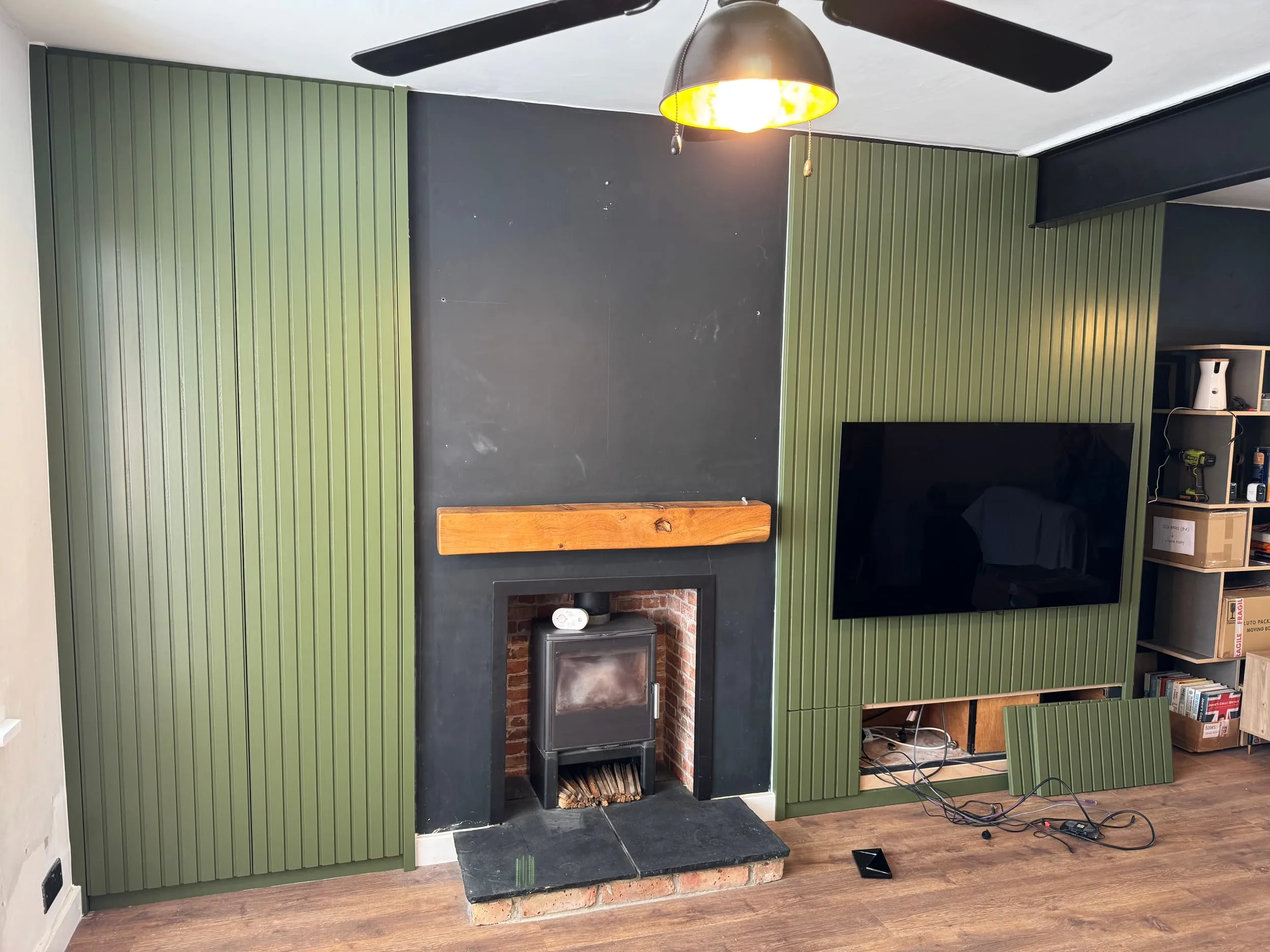Green Panelled Wall with Hidden Storage